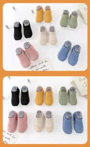 Showcasing multiple colors of soft-sole baby sock shoes for infant indoor walking
