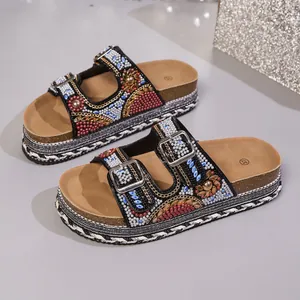 Glamorous women's platform sandals with colorful rhinestone embellishments and double buckles.