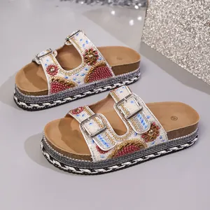 Bohemian style beaded platform sandals with rhinestones and double metal buckles.