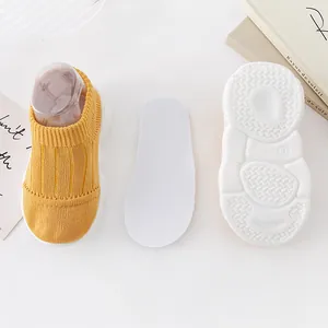 Yellow toddler knit sock-shoes with removable insole and non-slip sole for baby walking.