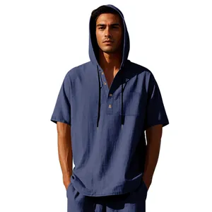 Close-up detail of navy blue linen hooded Henley shirt with functional pocket