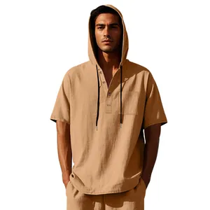 Detailed macro view of beige men's loose linen short-sleeve hooded Henley shirt