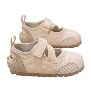 Lightweight beige girls' ballet-style training sneakers with breathable mesh panels