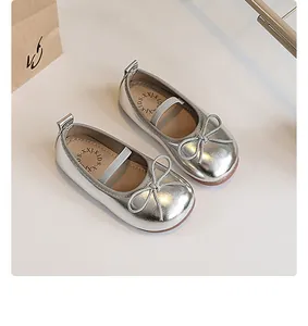 Elegant silver girls princess shoes featuring soft soles and delicate bow details