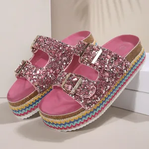 Pink glitter platform sandals with double gold buckles and rainbow woven soles