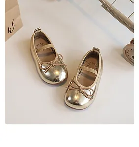 Elegant gold metallic Mary Jane shoes for toddler girls with soft soles and bow detail