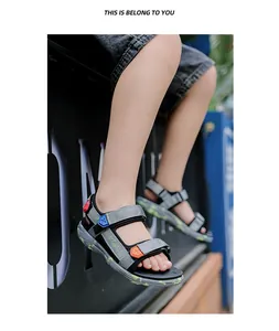 Detailed side view of boys' breathable outdoor beach sandals with colorful velcro straps