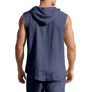 Back view of a blue linen hooded sleeveless shirt for men with textured fabric detail