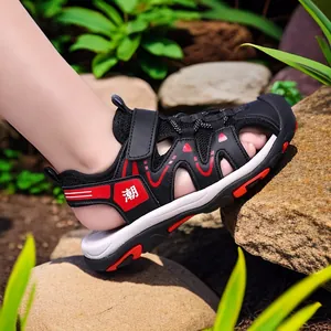 Durable boys' black and red closed-toe summer sandals with non-slip sole for outdoor beach fun.