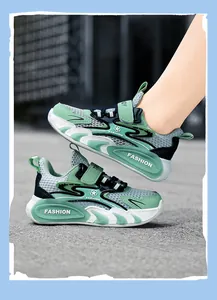 Close-up of breathable green mesh sneakers for boys with trendy fashion midsole details.