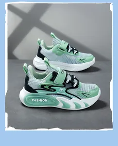Close-up of mint green breathable mesh fabric on boys' lightweight sports shoes.