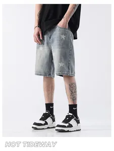 Stylish light blue denim shorts with star prints for men in a casual street style look