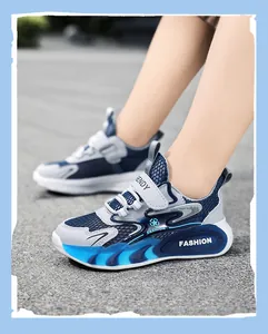 Detail shot of breathable blue mesh athletic shoes for boys with non-slip soles.