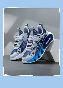 Close-up detail of boys blue breathable mesh sneakers featuring trendy velcro strap and fashion sole