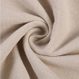 Macro view of breathable beige cotton linen fabric showing natural weave texture