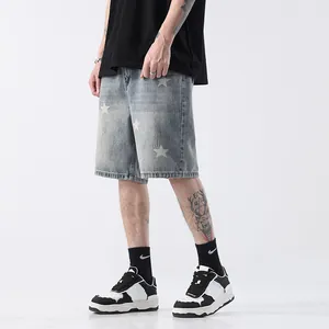 Men's light blue straight denim shorts with white star prints in streetwear style.