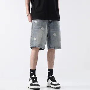 Light blue men's denim shorts featuring white star print and a classic straight leg fit
