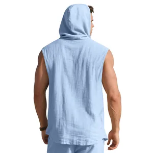 Rear view of a light blue linen sleeveless hooded shirt for men on a white background.