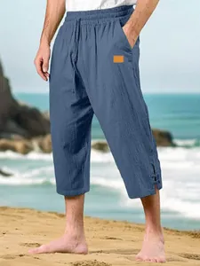 Men's blue cotton linen cropped beach pants with a drawstring waist and leather label