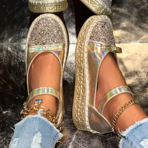 Detailed view of holographic Mary Jane platform shoes with shimmering sequin toe cap