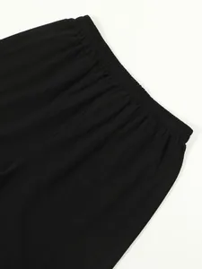 Close-up of the comfortable elastic waistband on men's black cotton linen shorts