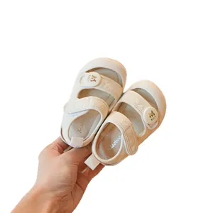 Soft sole toddler sandals in cream white with quilted straps for baby first walking