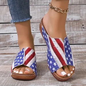 Detail of wedge sandals for women featuring American flag stars and stripes pattern