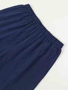 Detailed close-up view of the elastic waistband on navy blue cotton linen shorts
