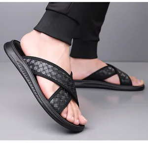 Detailed view of men's black woven strap sandals featuring breathable non-slip comfort soles.