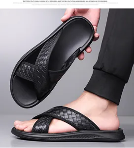 Detail view of men's stylish black woven strap sandals with breathable non-slip soles