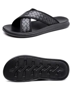 Modern black men's woven cross-strap slide sandals showing top and anti-slip tread patterns
