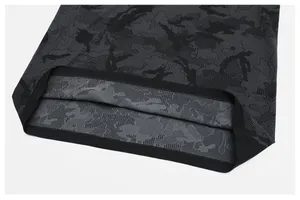 Detailed macro view showing the seamless camouflage jacquard fabric and durable hemline
