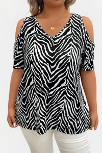 Detail of plus size V-neck top with zebra print and stylish cold shoulder cutouts for summer.