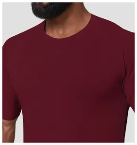 Close-up of a wine red sports t-shirt showing seamless wavy fabric texture detail
