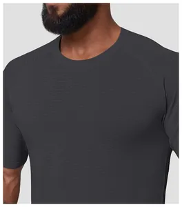 Detailed macro view of men's grey seamless quick-dry sports t-shirt with wave texture