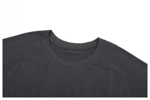 Close-up detail of grey men's sports t-shirt showing crew neckline and wavy textured fabric