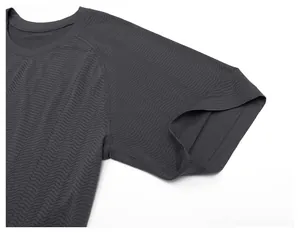 Close-up of a men's dark grey seamless quick-dry sports t-shirt with wavy texture