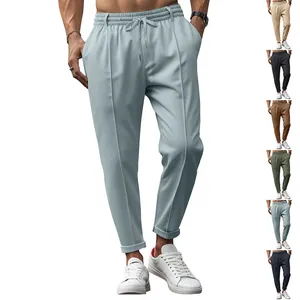 Men's slim-fit casual pants with drawstring waist and tapered leg in multiple colors.