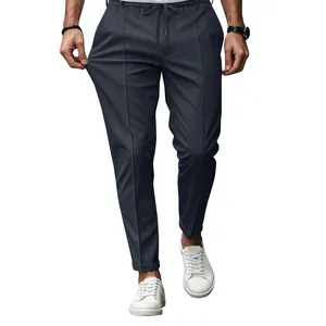 Detail of men's slim fit stretch casual pants in navy blue with drawstring waist.