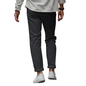 Back view detail of men's slim fit casual trousers in dark grey with stylish cuffed ankles