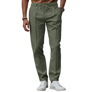 Close-up of men's olive green slim-fit casual trousers with drawstring waist detail.