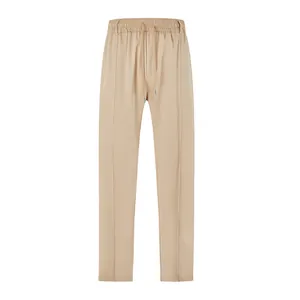 Close-up of khaki men's business casual trousers featuring drawstring waist and pleat details