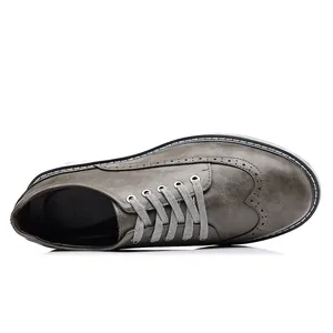 Graue Brogue-Lederschuhe für Herren mit klassischer Flügelspitze-Perforation