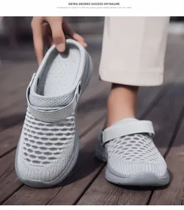 Detailed view of breathable grey fly-knit mesh fabric on casual summer mule clogs.
