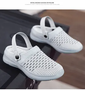 Detail view of the breathable flyknit mesh upper on these comfortable grey women's garden clogs