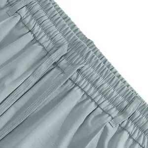 Detailed macro view of elastic waistband with drawstring on men's casual trousers