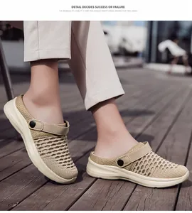 Detail view of breathable beige fly-woven mesh mules for women on a wooden deck