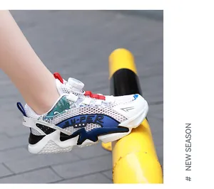Close-up of breathable mesh children's running shoe with quick-dial lacing system