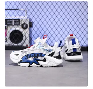 Breathable white and blue children's mesh running shoes with rotary dial laces.