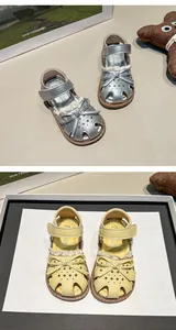 Close-up details of girls closed-toe summer sandals featuring bow-knot and soft soles